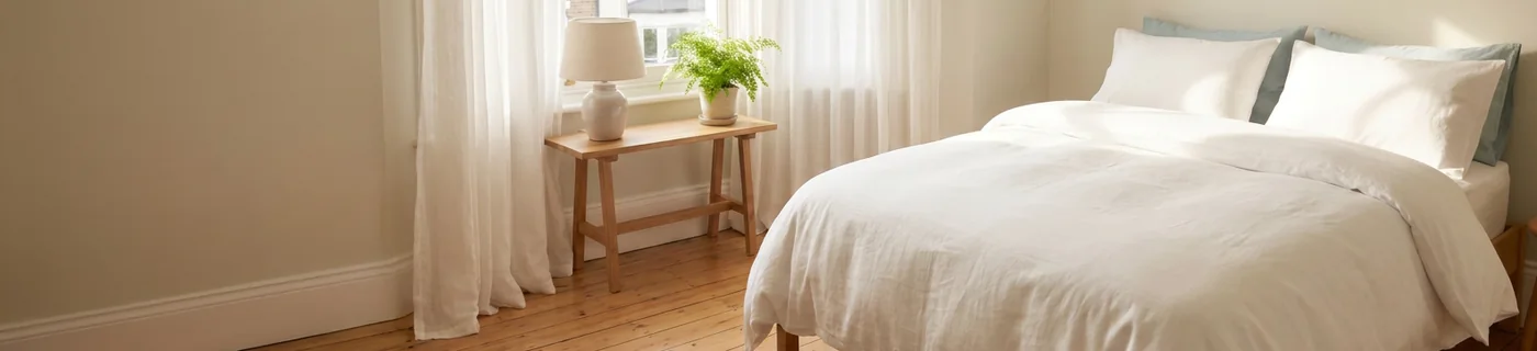 Neatly made bed and clean bedroom in a Derby house